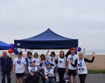 Worthing 10k 2021 - Wearing medals at Gazebo