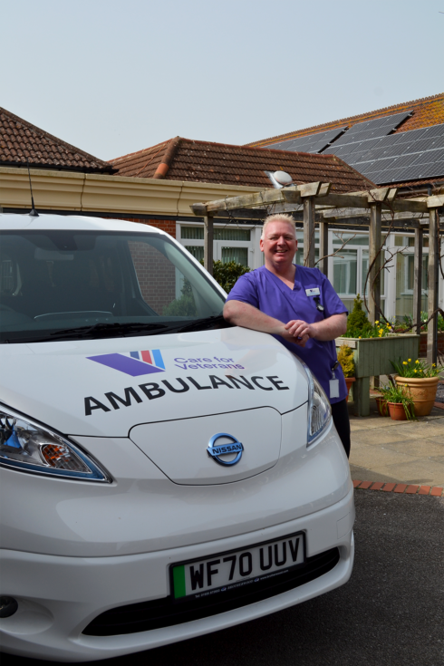 Healthcare Assistant, Lee Brace, with the new electric-powered ambulance